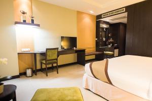 Ein Bett oder Betten in einem Zimmer der Unterkunft Intimate Hotel Pattaya - SHA Extra Plus