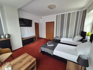 Posteľ alebo postele v izbe v ubytovaní Apartamenty Amadeus