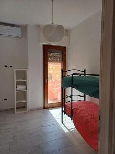 Katil atau katil-katil dalam bilik di Dimora Mediterranea Portopaglia