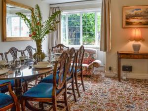 a dining room with a table and chairs at Number Three in Bridlington +23 photos