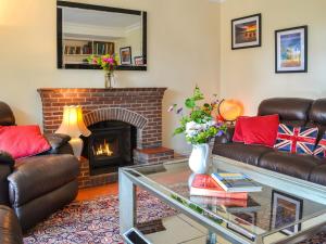 a living room with two couches and a fireplace at Number Three in Bridlington