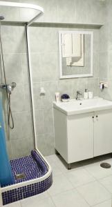 a bathroom with a shower and a sink at Casa Indalo Mojácar in Mojácar +34 photos