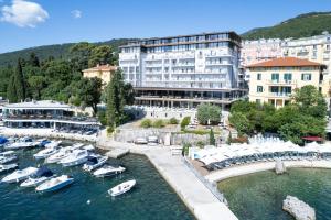 a group of boats in the water in a harbor at Amadria Park Grand Hotel 4 Opatijska Cvijeta in Opatija
