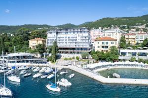 a group of boats docked in a harbor with buildings at Amadria Park Grand Hotel 4 Opatijska Cvijeta in Opatija