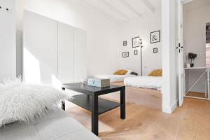 En eller flere senge i et værelse på Apartamento Can Petit