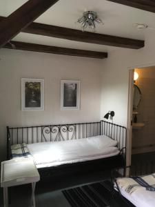 a bedroom with a bed and a ceiling at Nova Harmonia in Sankt Ibb