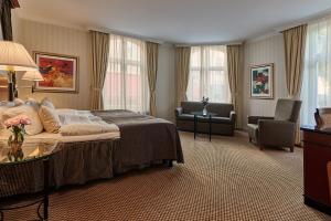 Postel nebo postele na pokoji v ubytování Elite Hotel Mollberg