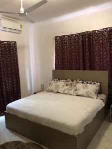 Ένα ή περισσότερα κρεβάτια σε δωμάτιο στο ABO Apartments