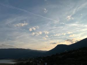 a view of a valley with mountains and a sky at Apartmani Venecia in Prozor