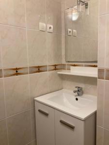 a bathroom with a sink and a mirror at Ocean & Chill in Lacanau +7 photos