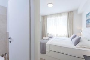Voodi või voodid majutusasutuse Sunset Split Rooms toas