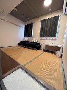 Posezení v ubytování 心斎橋難波関空直通Kumano Sanctum Ambers Hostel