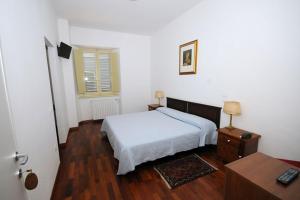 Ένα ή περισσότερα κρεβάτια σε δωμάτιο στο Guest House Domus Urbino