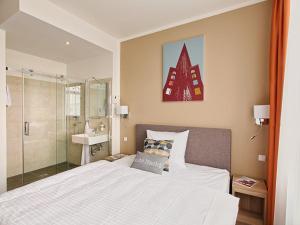 Ein Bett oder Betten in einem Zimmer der Unterkunft BO Hotel Hamburg