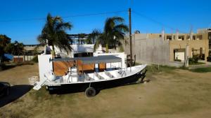 a boat parked in front of a building at Puerto San Carlos Bay House & Tours -1st & 2nd Floor- in San Carlos
