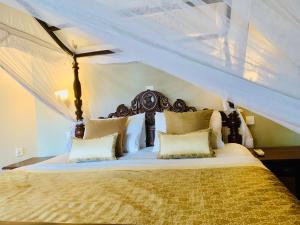 a bedroom with a bed with a canopy at Suite Lanka in Hikkaduwa +115 photos