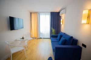 Televiisor ja/või meelelahutuskeskus majutusasutuses MY SUNSHINE APARTMENTS BATuMI