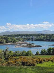 a view of a bridge over a river at The Caravan in Anglesey +6 photos