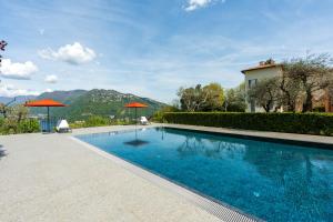 Swimmingpoolen hos eller tæt på Villa Maderni Breathtaking - by MyHomeInComo