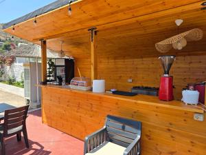 a kitchen with a counter with a blender on it at Leva's Apartments in Sarandë