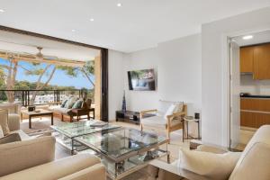 a living room with a glass coffee table at Apartamento Puerto Portals in Portals Nous