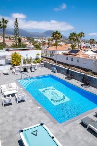 a pool on the roof of a house at Villa El Padrino in Callao Salvaje