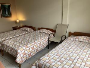 Voodi või voodid majutusasutuse Hotel Guadalupe toas
