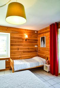 Postel nebo postele na pokoji v ubytování Gîte Le Passe Montagne 10 personnes