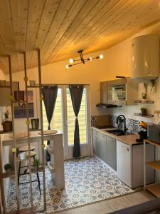 a kitchen with a sink and a counter top at Maison cosy in Ambarès-et-Lagrave