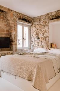 Giường trong phòng chung tại Casa Allegra - House da papà