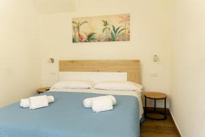 Llit o llits en una habitació de Villa Sofia- UN LETTO IDEALE