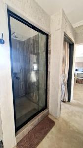 a large glass window in a living room with a room at Lala Panzi in Ghanzi