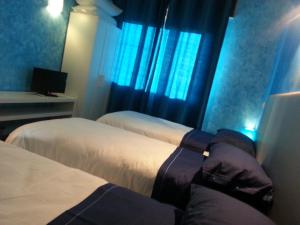 Letto o letti in una camera di Fenix