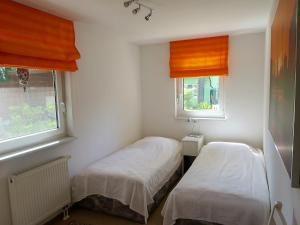 Ένα ή περισσότερα κρεβάτια σε δωμάτιο στο Ferienhaus Schillo