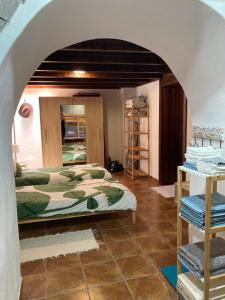 Ένα ή περισσότερα κρεβάτια σε δωμάτιο στο Casa Cueva - L&L