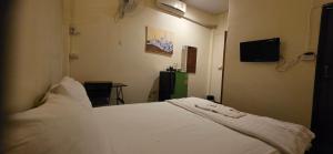 Postel nebo postele na pokoji v ubytování P.L.P Guesthouse - Mae Hong Son