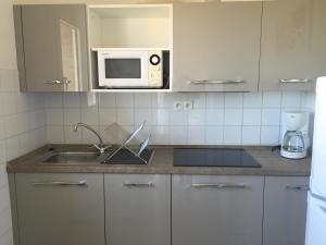 Kuchyň nebo kuchyňský kout v ubytování Résidence Beau rivage