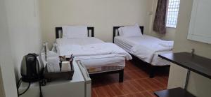 Postel nebo postele na pokoji v ubytování P.L.P Guesthouse - Mae Hong Son