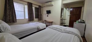 Postel nebo postele na pokoji v ubytování P.L.P Guesthouse - Mae Hong Son