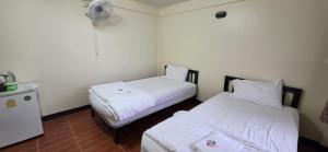 Postel nebo postele na pokoji v ubytování P.L.P Guesthouse - Mae Hong Son