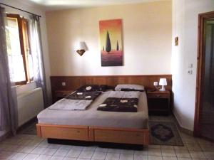 a bedroom with a bed in a room at Remser Haus in Zalakaros
