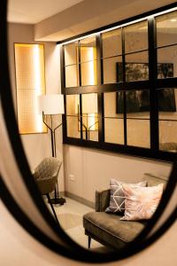 a view of a living room with a couch and window at Hotel Puerta del Mar - Adults Recommended in Nerja