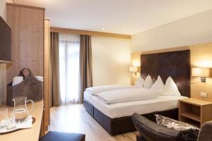 Ένα ή περισσότερα κρεβάτια σε δωμάτιο στο Hotel Stefanshof
