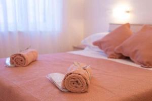 Postel nebo postele na pokoji v ubytování Apartment Malinska 34