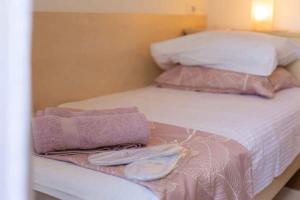 Postel nebo postele na pokoji v ubytování Apartment Malinska 34