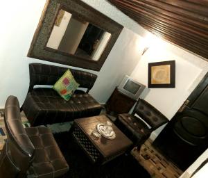 an overhead view of a living room with a couch and chair at Palais AL Firdaous in Fès