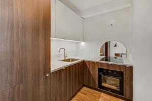 Kuchyň nebo kuchyňský kout v ubytování Apartman Metropolis