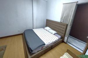 Postel nebo postele na pokoji v ubytování Sukhum Sukhumvit-Onnut Guest House