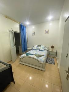a bedroom with a bed in a room at Appartement Najma in Tangier