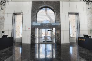 a lobby of a building with a revolving door at Sentido Reef Oasis Suakin Resort in Marsa Alam City +199 photos